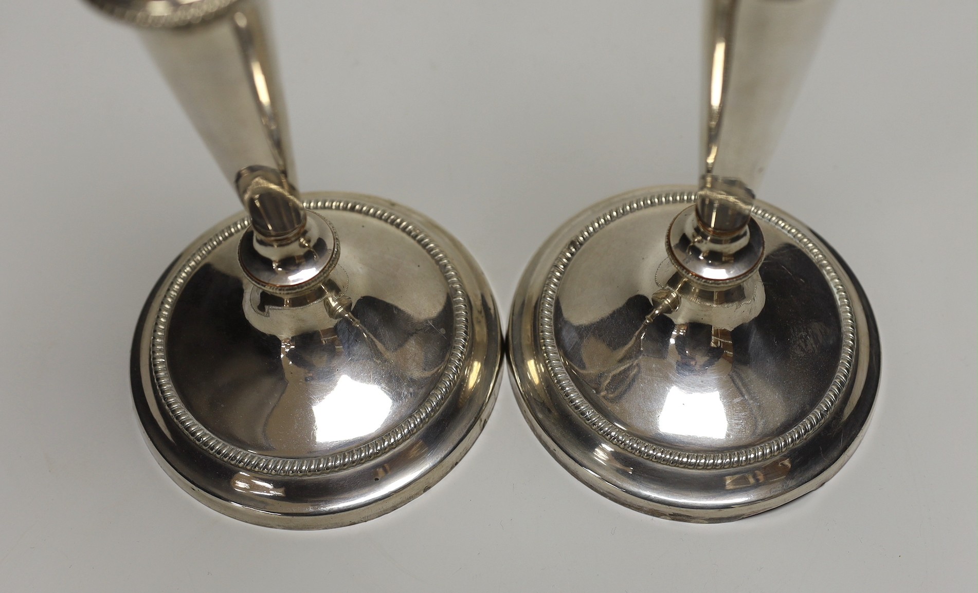 A pair of early 19th century Old Sheffield plate candlesticks. 28cm high